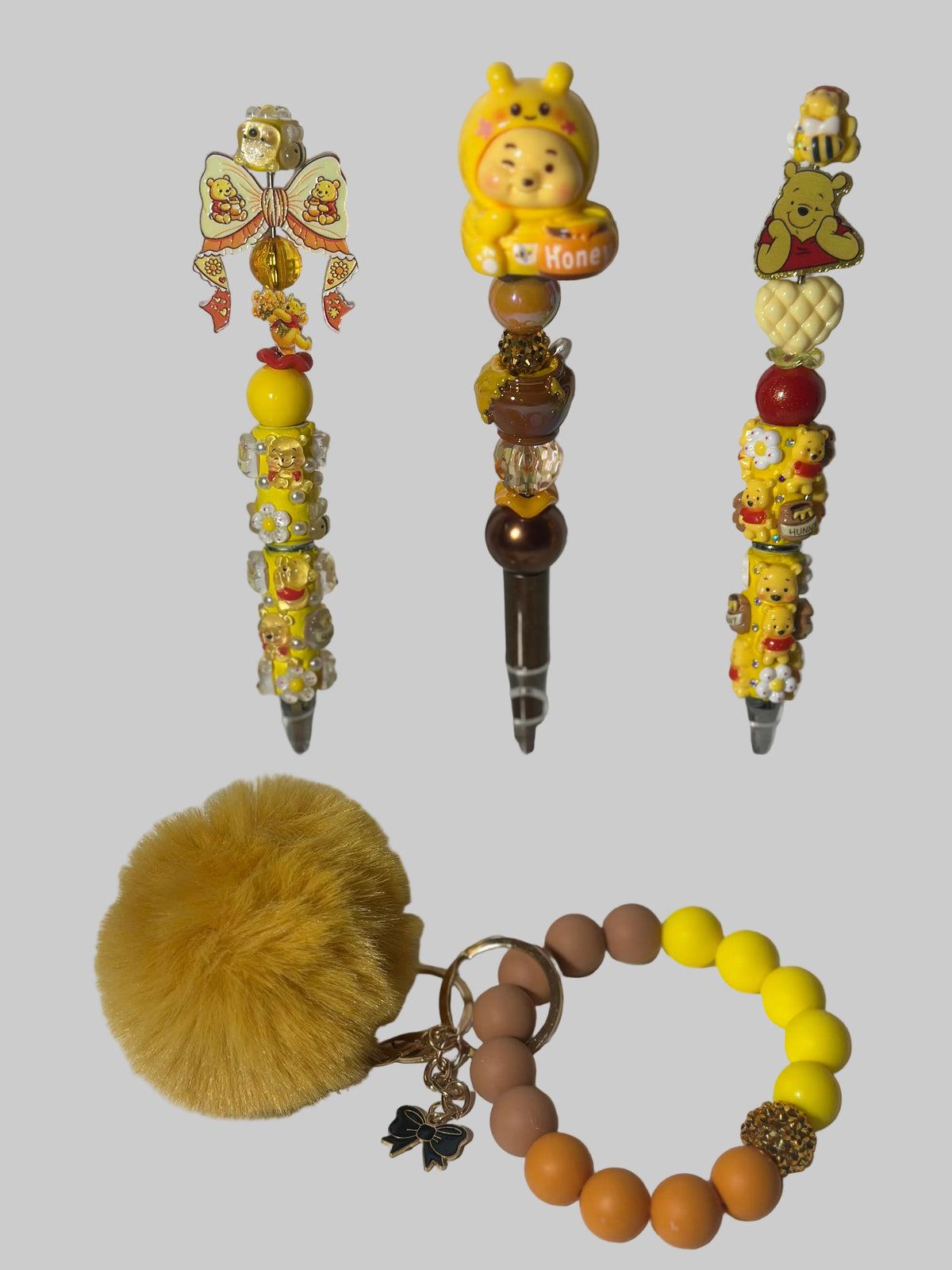 Winnie the Pooh Themed pens & Wristlets