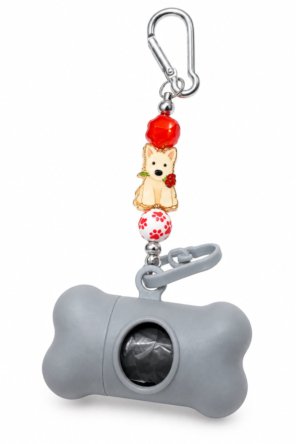 A gray bone-shaped dog poop bag dispenser keychain with a silver carabiner, featuring a teddy bear charm and a red balloon charm, displayed on a white surface.